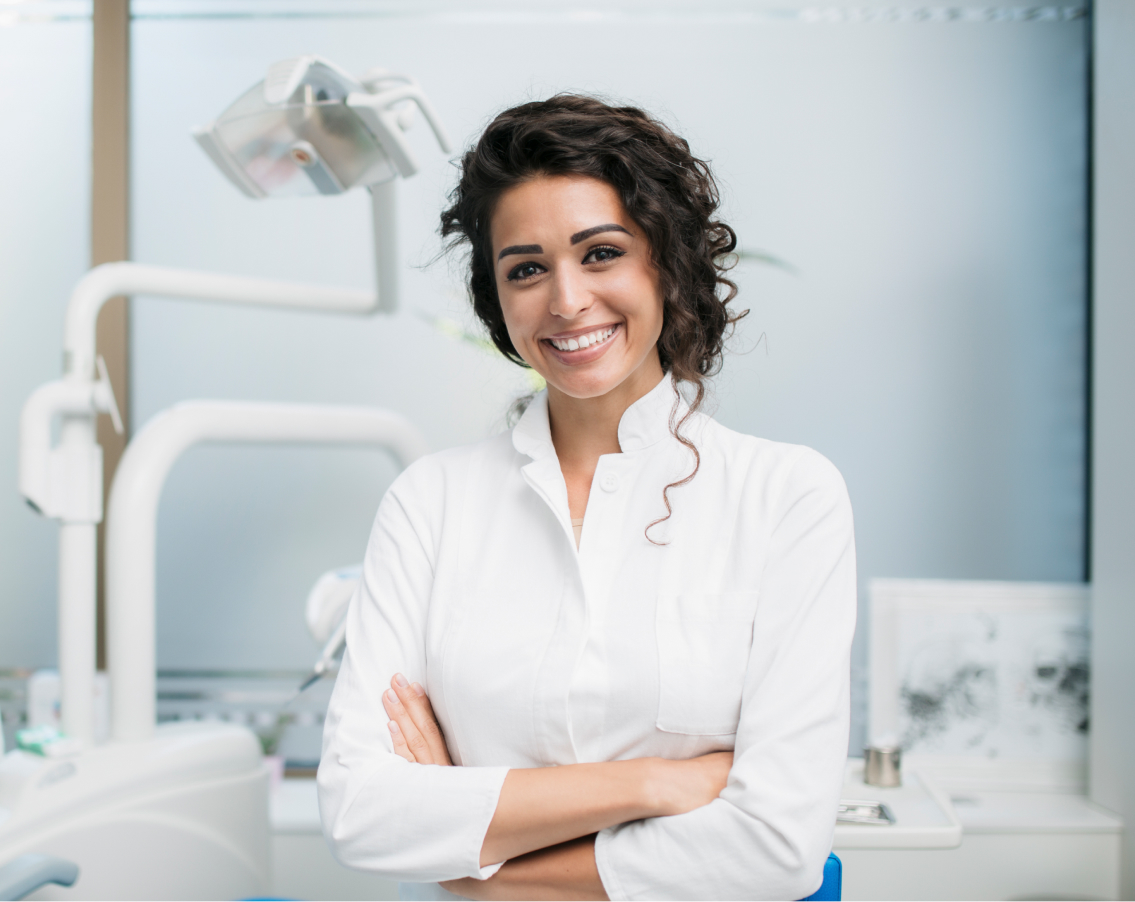 Dentist standing in front of equipment